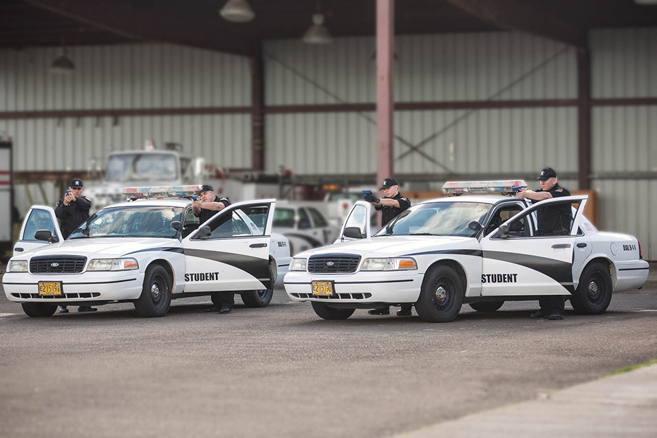 Criminal Justice Students at vehicles